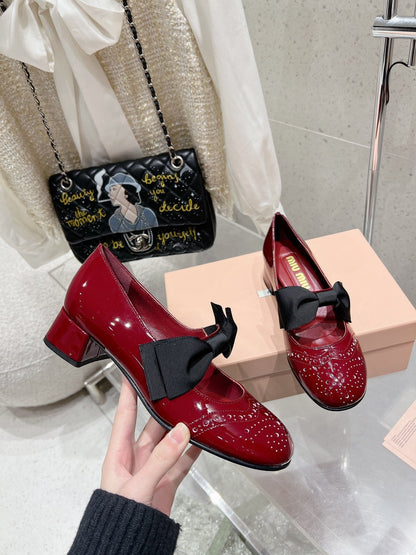 MARY JANE MID HEEL PUMPS IN RUBY RED PATENT LAMBSKIN WITH BOW