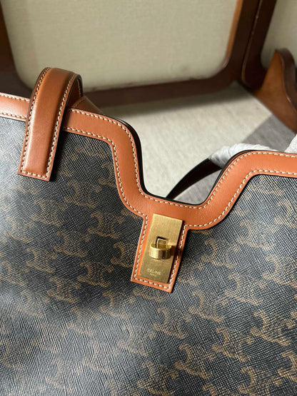 CABAS 37 IN BLACK TRIOMPHE CANVAS AND BRONZE BROWN CALFSKIN TRIM GOLD LOCK