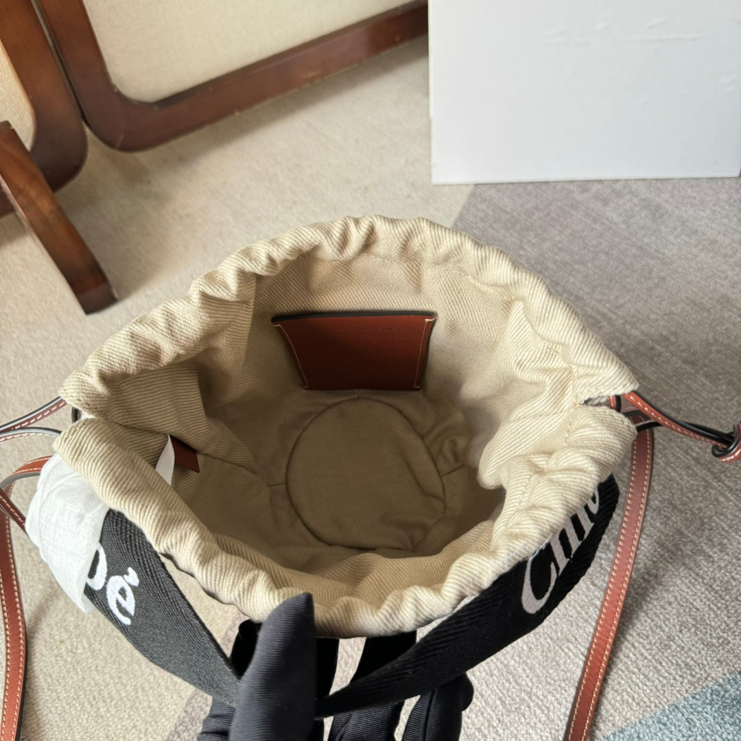 SMALL WOODY BASKET 17 IN NATURAL FIBERS BLACK WEBBING BROWN CALFSKIN