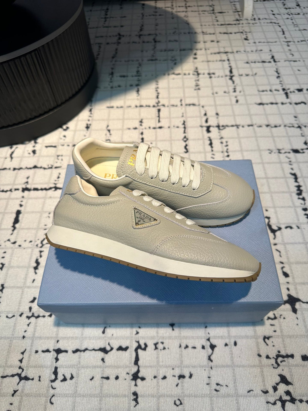 PRA TRIANGLE LOGO SNEAKERS LIGHT GRAY CALFSKIN