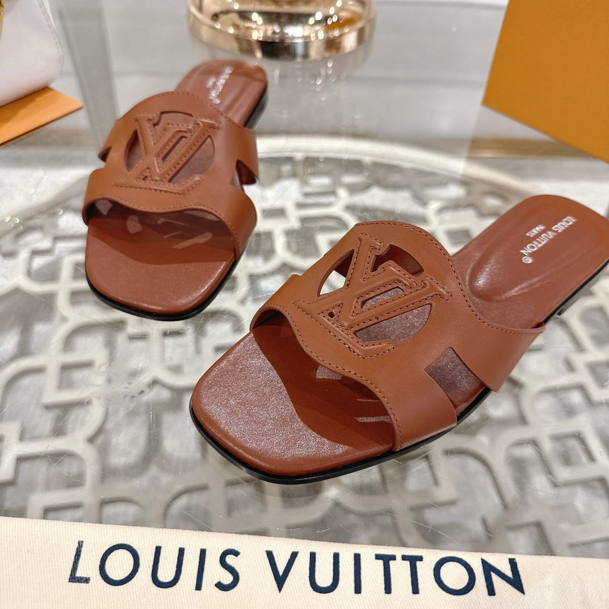 ISOLA FLAT SLIDE IN PENNY BROWN CALFSKIN