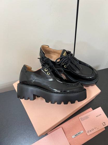 LACE-UP LOAFERS WITH THICK SOLE IN BLACK SHINY SHEEPSKIN