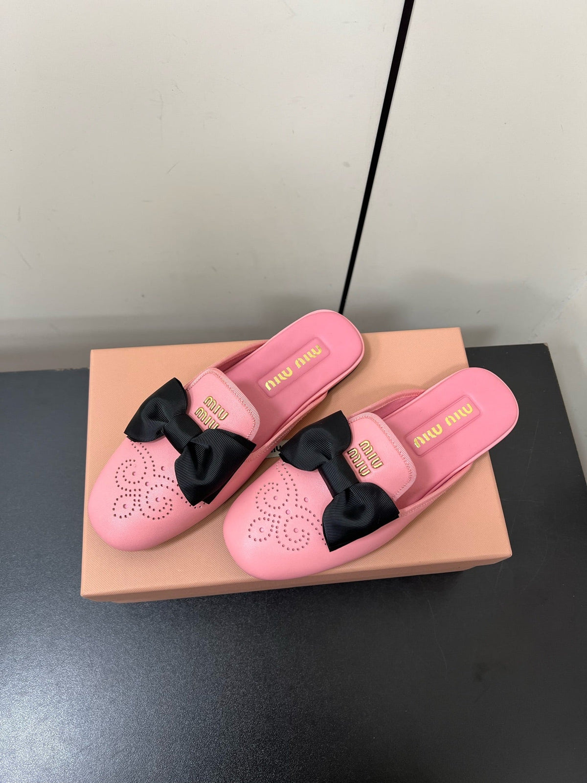 BOW MULES IN PINK SHEEPSKIN