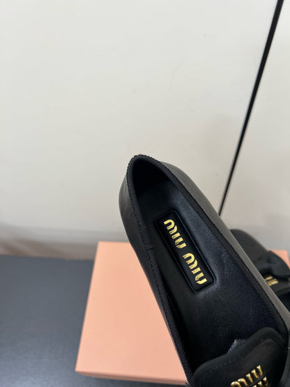 LOAFERS WITH BOW IN BLACK SHEEPSKIN