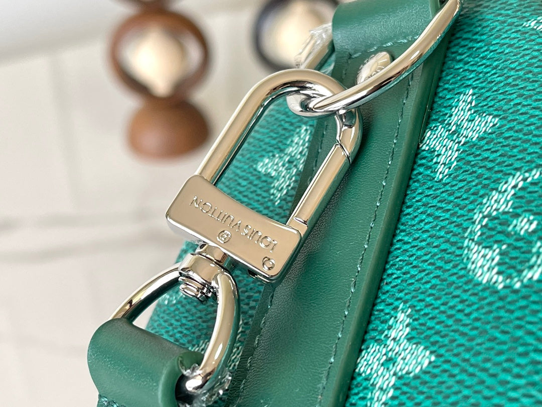 KEEPALL BANDOULIÈRE 25 IN GREEN MONOGRAM HERITAGE CANVAS