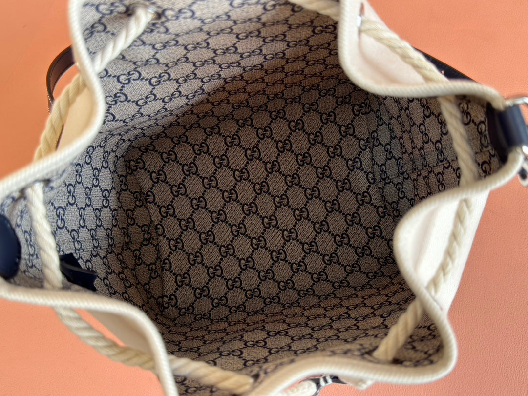 DRAWSTRING SHOULDER BAG LOGO PRINT 31 IN WHITE CANVAS DARK BLUE CALFSKIN