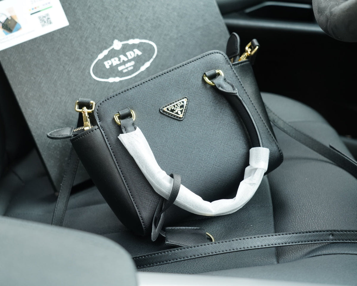 RE-EDITION TOP HANDLE BAG 20 IN BLACK CALFSKIN