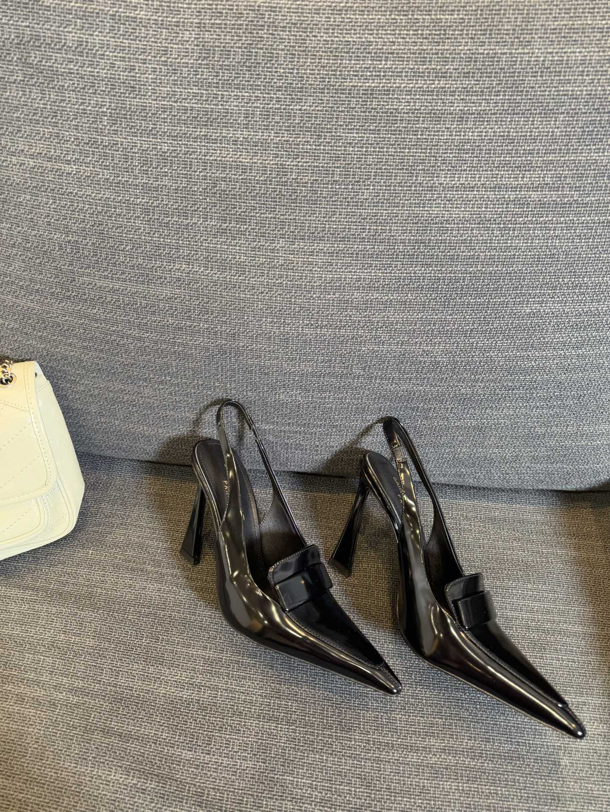 POINTED-TOE SLINGBACK PUMPS IN BLACK SHINY CALFSKIN
