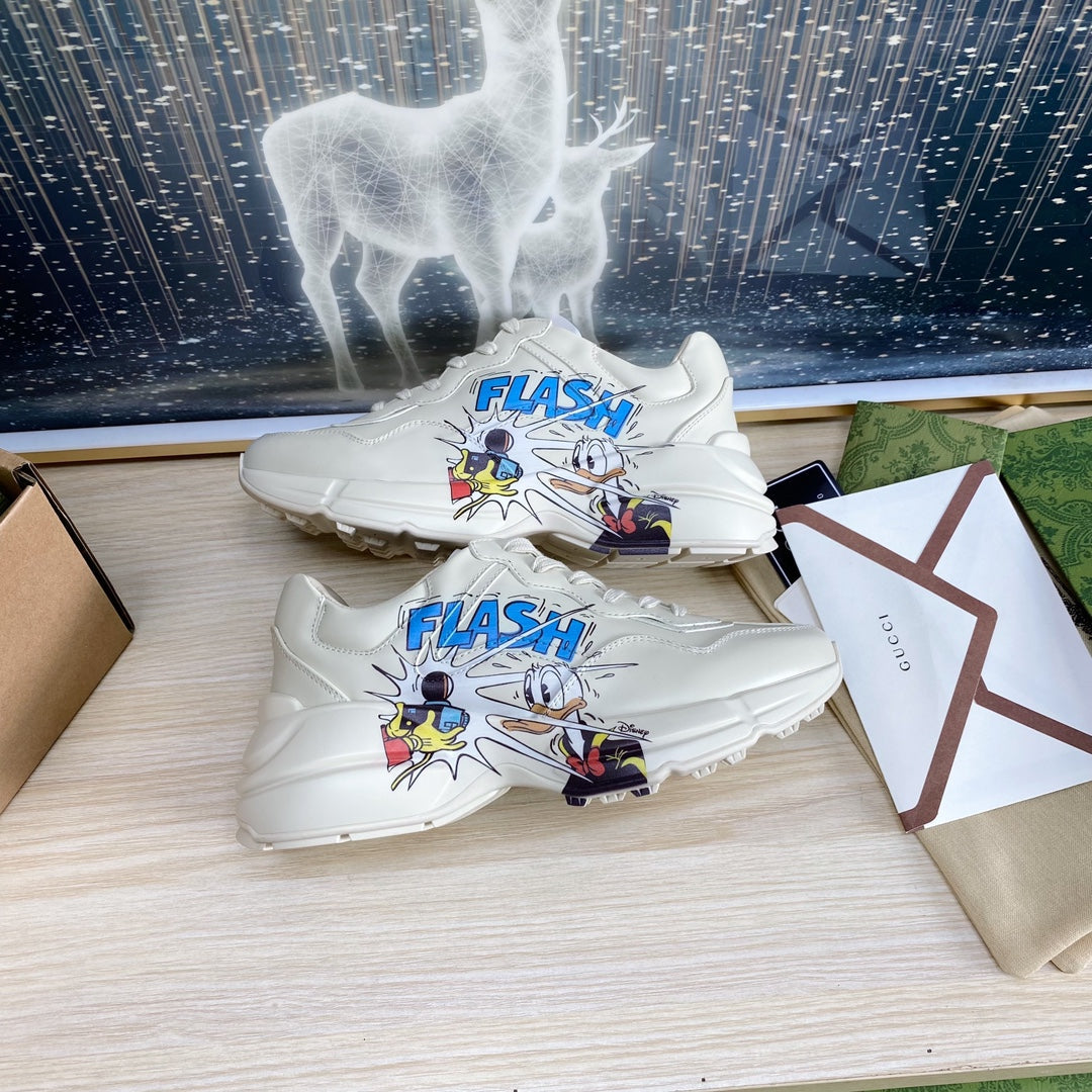 GG COUPLE TRAINER WHITE CALFSKIN WITH DONALD DUCK ICON