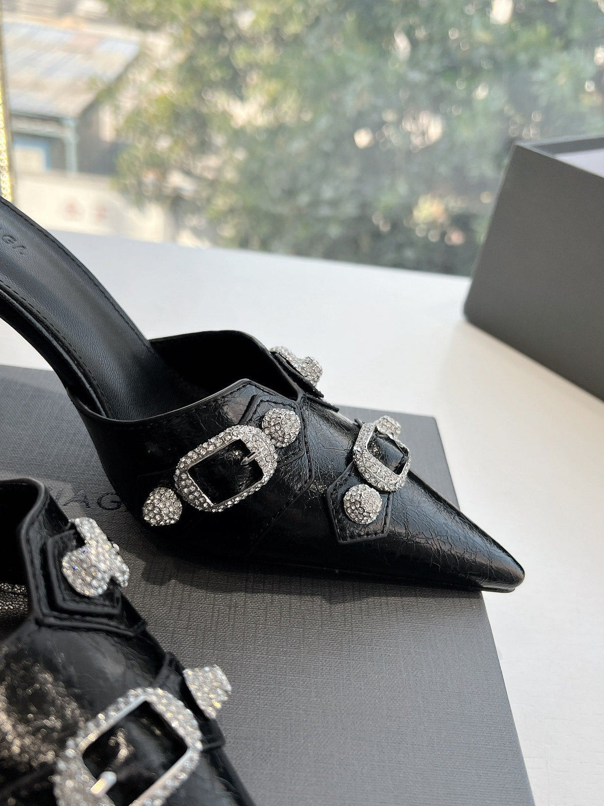 CRYSTAL BUCKLE BLACK WAX-OIL SHEEPSKIN HEELED MULES