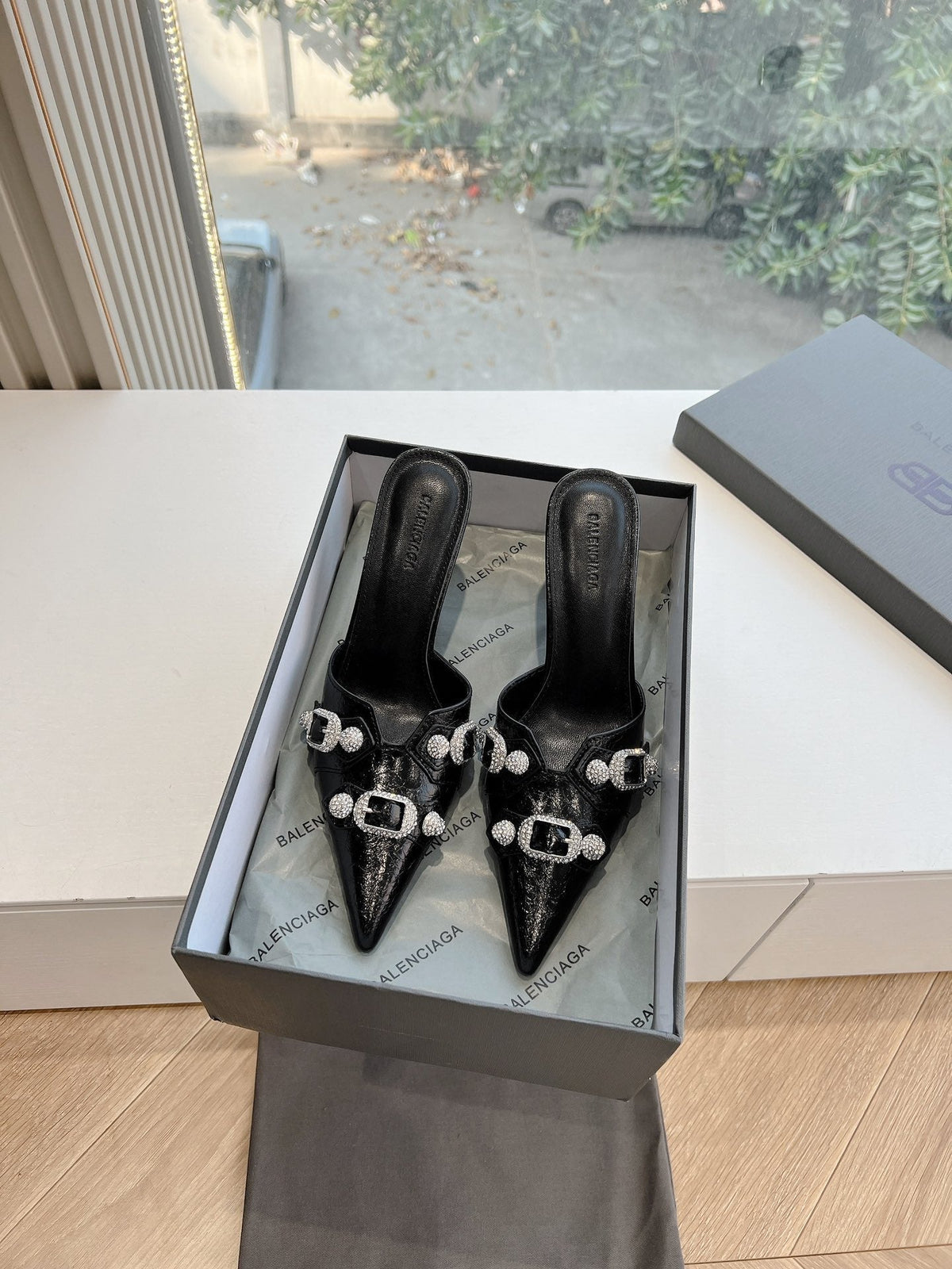 CRYSTAL BUCKLE BLACK WAX-OIL SHEEPSKIN HEELED MULES