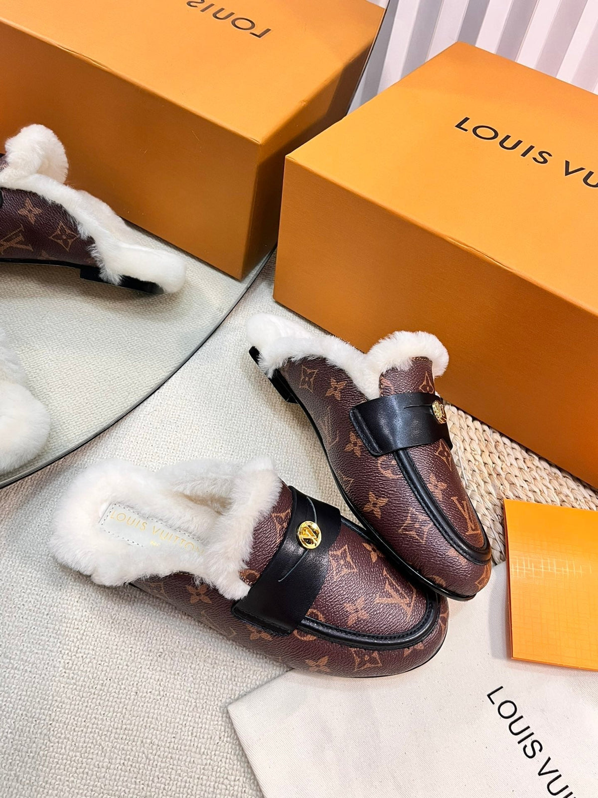 FLAT MULE IN CHESTNUT BROWN MONOGRAM CALFSKIN AND SHEARLING LINING