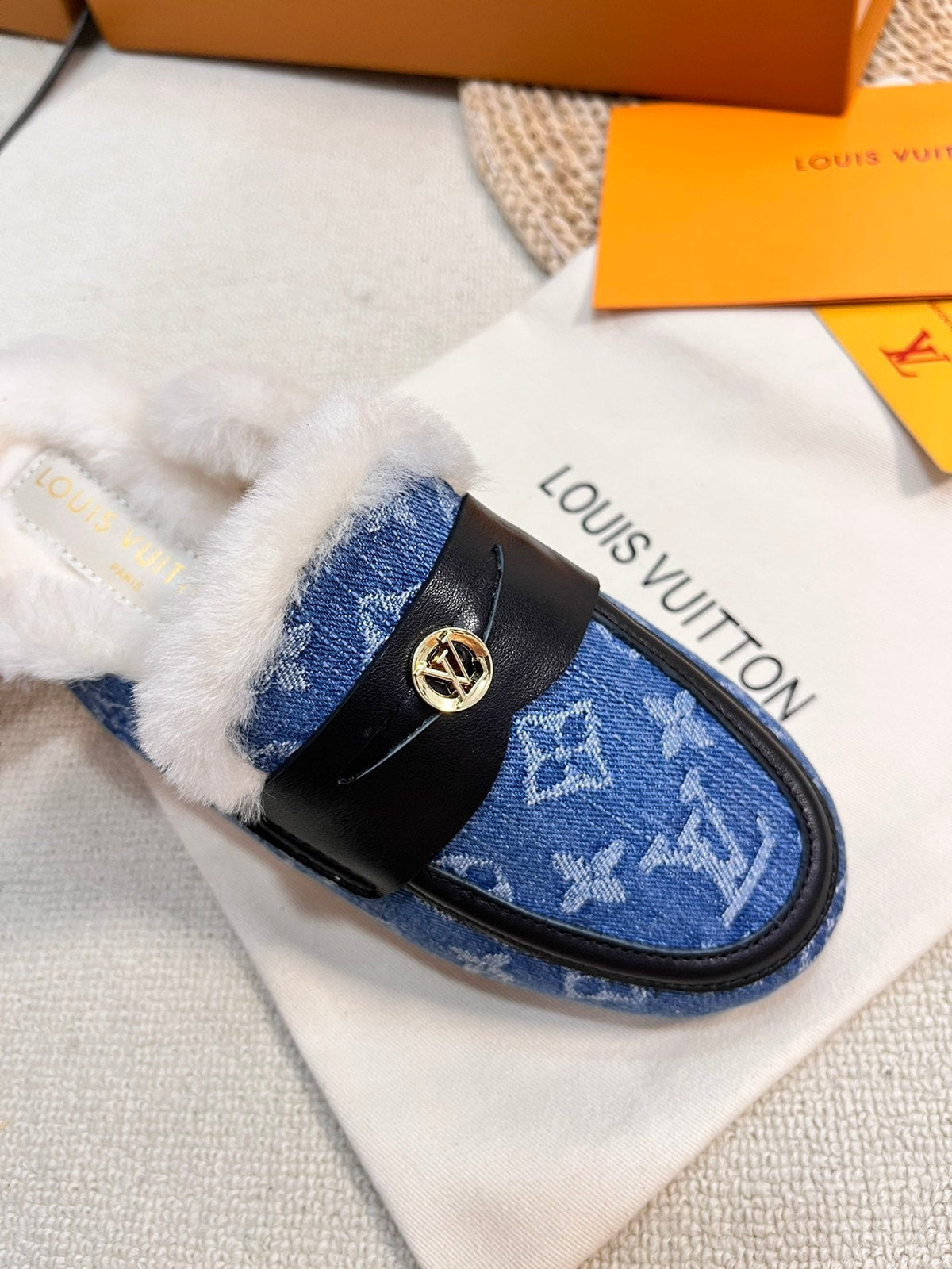 FLAT MULE IN COBALT BLUE MONOGRAM DENIM AND SHEARLING LINING