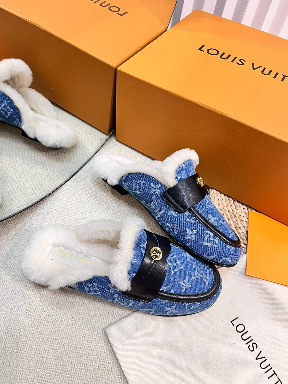 FLAT MULE IN COBALT BLUE MONOGRAM DENIM AND SHEARLING LINING