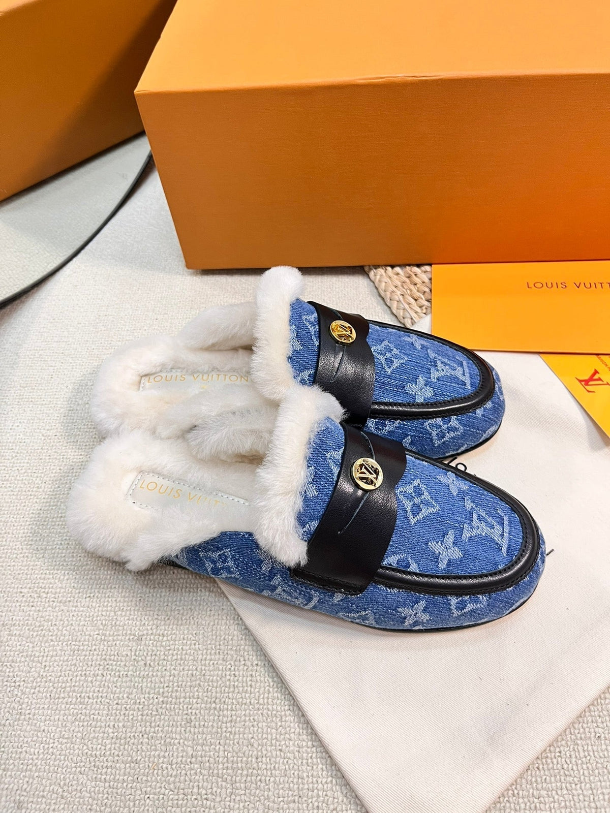 FLAT MULE IN COBALT BLUE MONOGRAM DENIM AND SHEARLING LINING