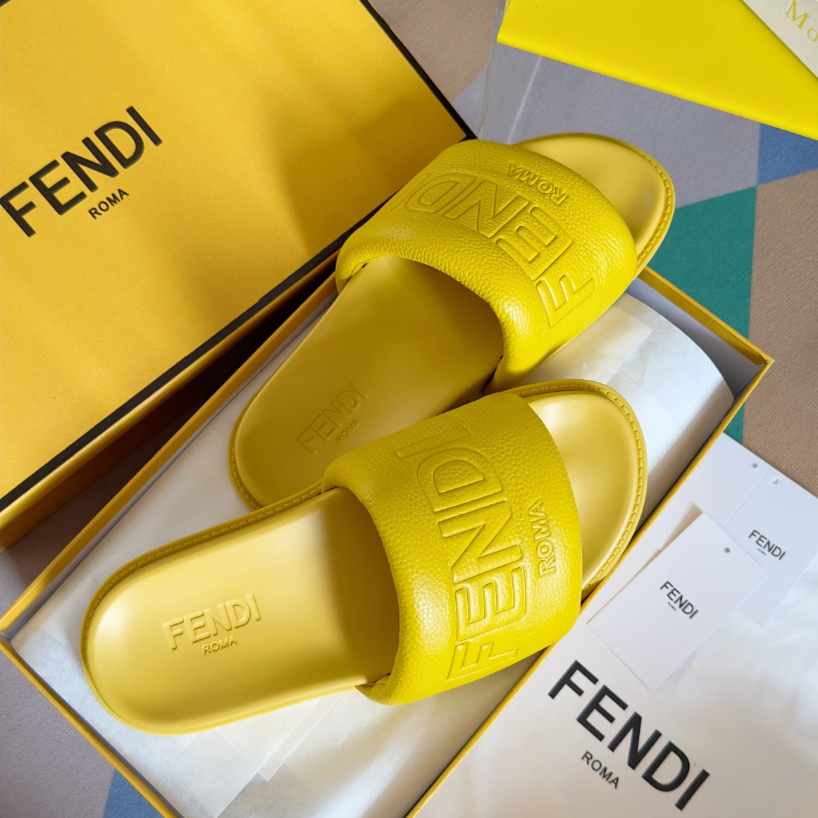 FENDI ROMA SLIDES IN SUNSHINE YELLOW FUSSBETT LAMBSKIN