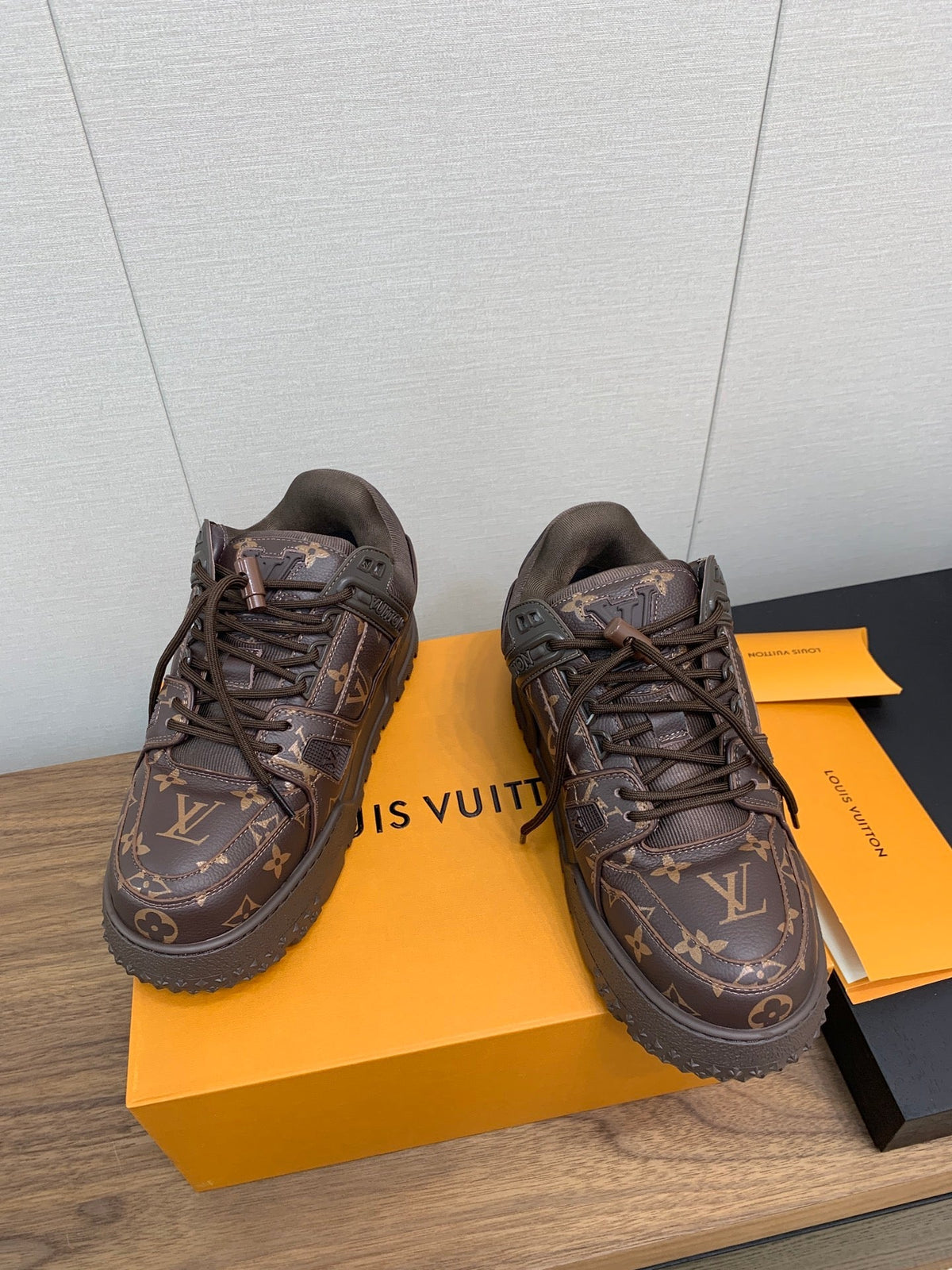 LV TRAINER IN CHOCOLATE BROWN MONOGRAM CALFSKIN