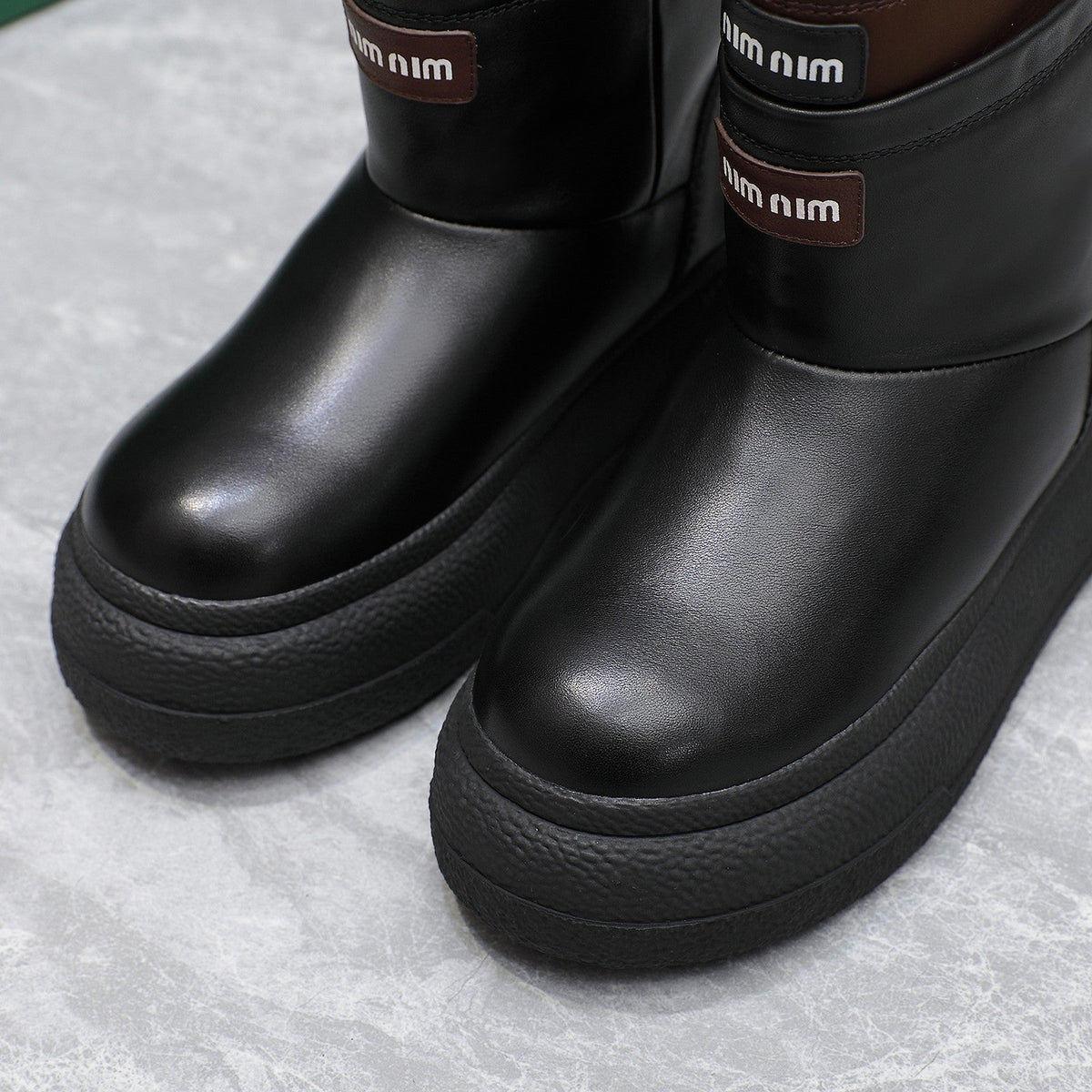 THICK-SOLED SNOW BOOTS IN BLACK CALFSKIN MIX CHOCOLATE NYLON