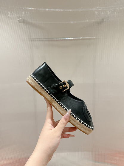 GG CROSS STRAP FLAT SHOES IN BLACK CALFSKIN WITH STRAW SOLE