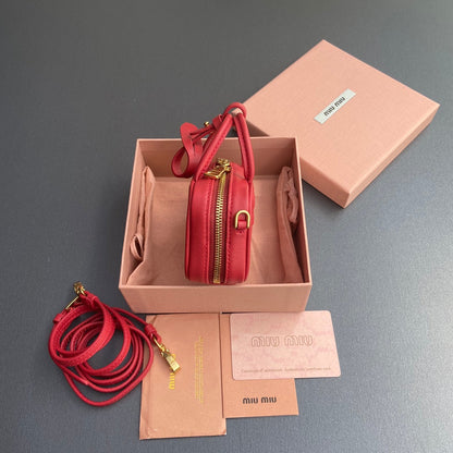 MICRO BAG KEYCHAIN 11 IN TALL POPPY RED CALFSKIN EMBOSSED LOGO