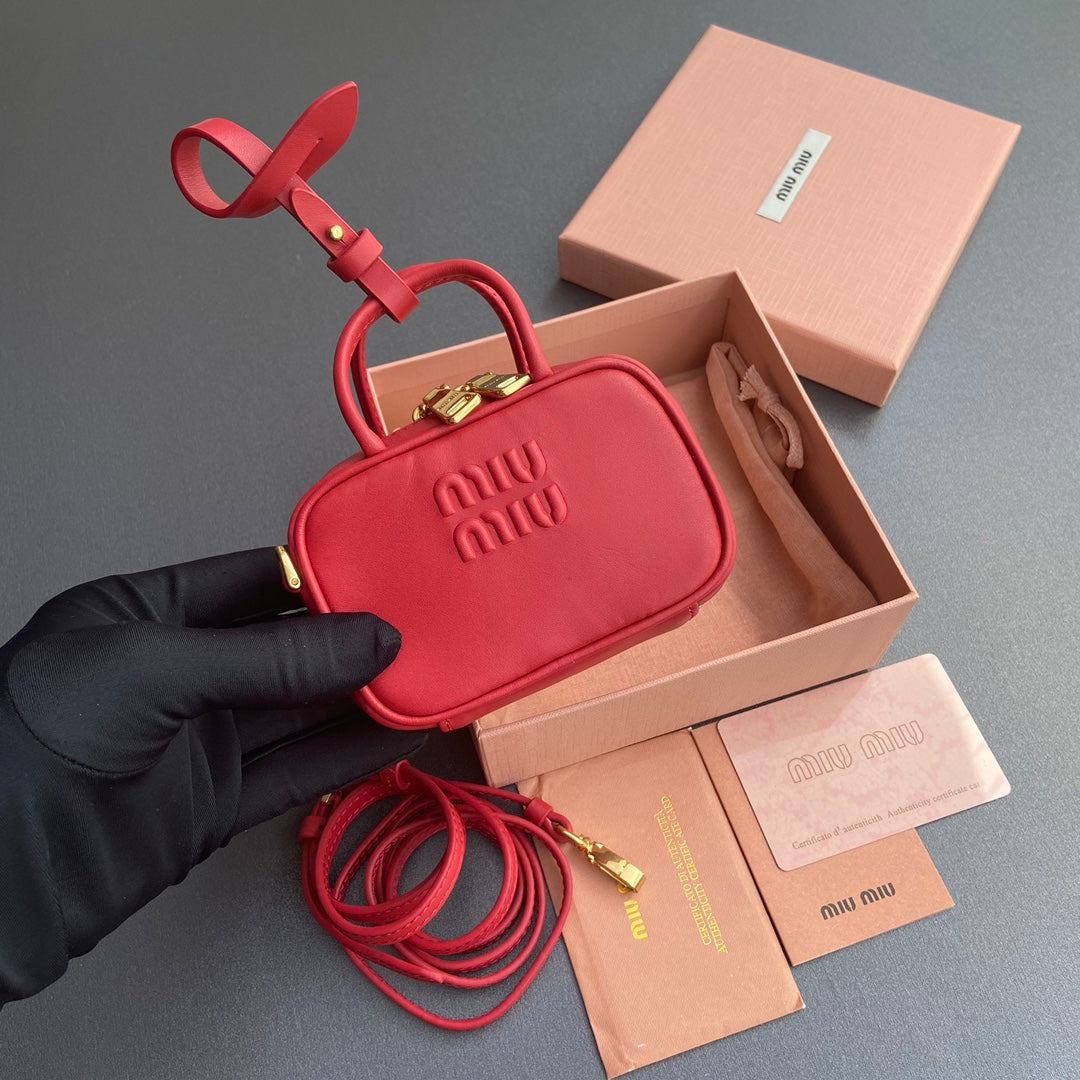 MICRO BAG KEYCHAIN 11 IN TALL POPPY RED CALFSKIN EMBOSSED LOGO