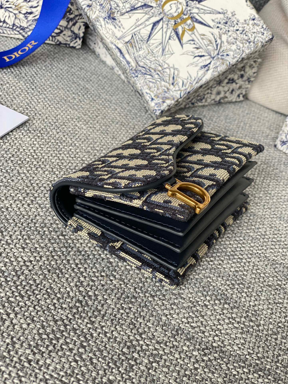 SADDLE LOTUS WALLET 11 IN BLACK MONOGRAM OBLIQUE JACQUARD