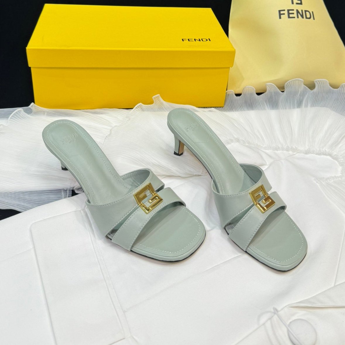 FENDI MEDIUM-HEELED 55 MM MULE IN ASH GREY LAMBSKIN WITH GOLD HARDWARE