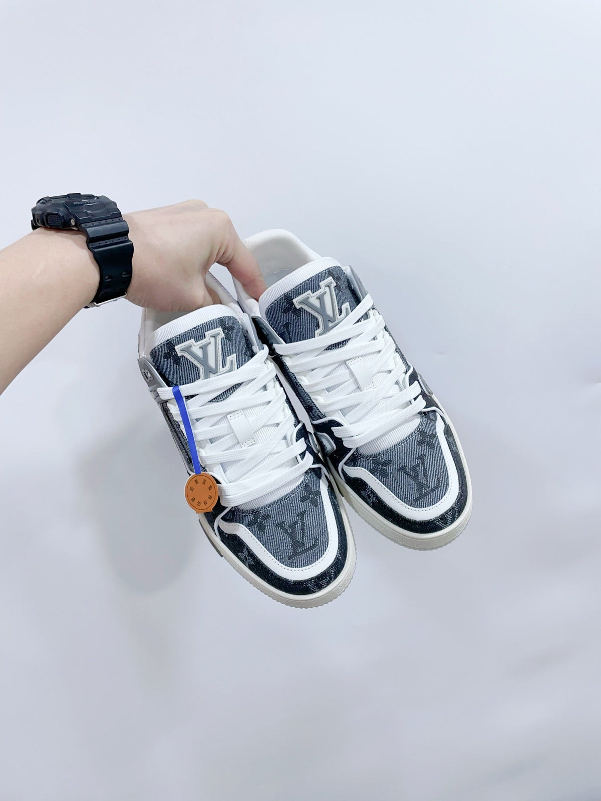 LV TRAINER SNEAKER IN DOVE GRAY MONOGRAM DENIM