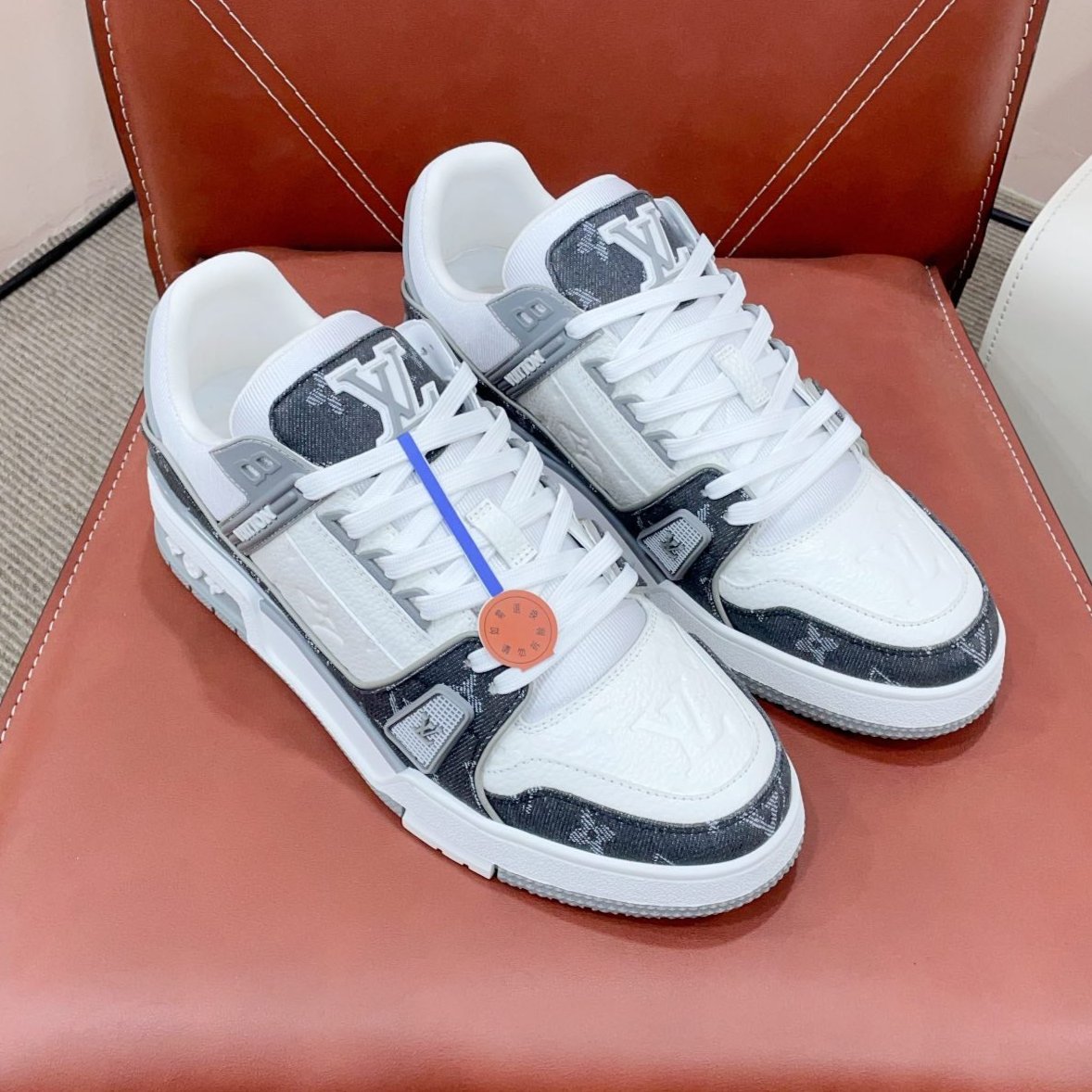 LV TRAINER SNEAKER IN WHITE CALFSKIN AND BLACK MONOGRAM DENIM