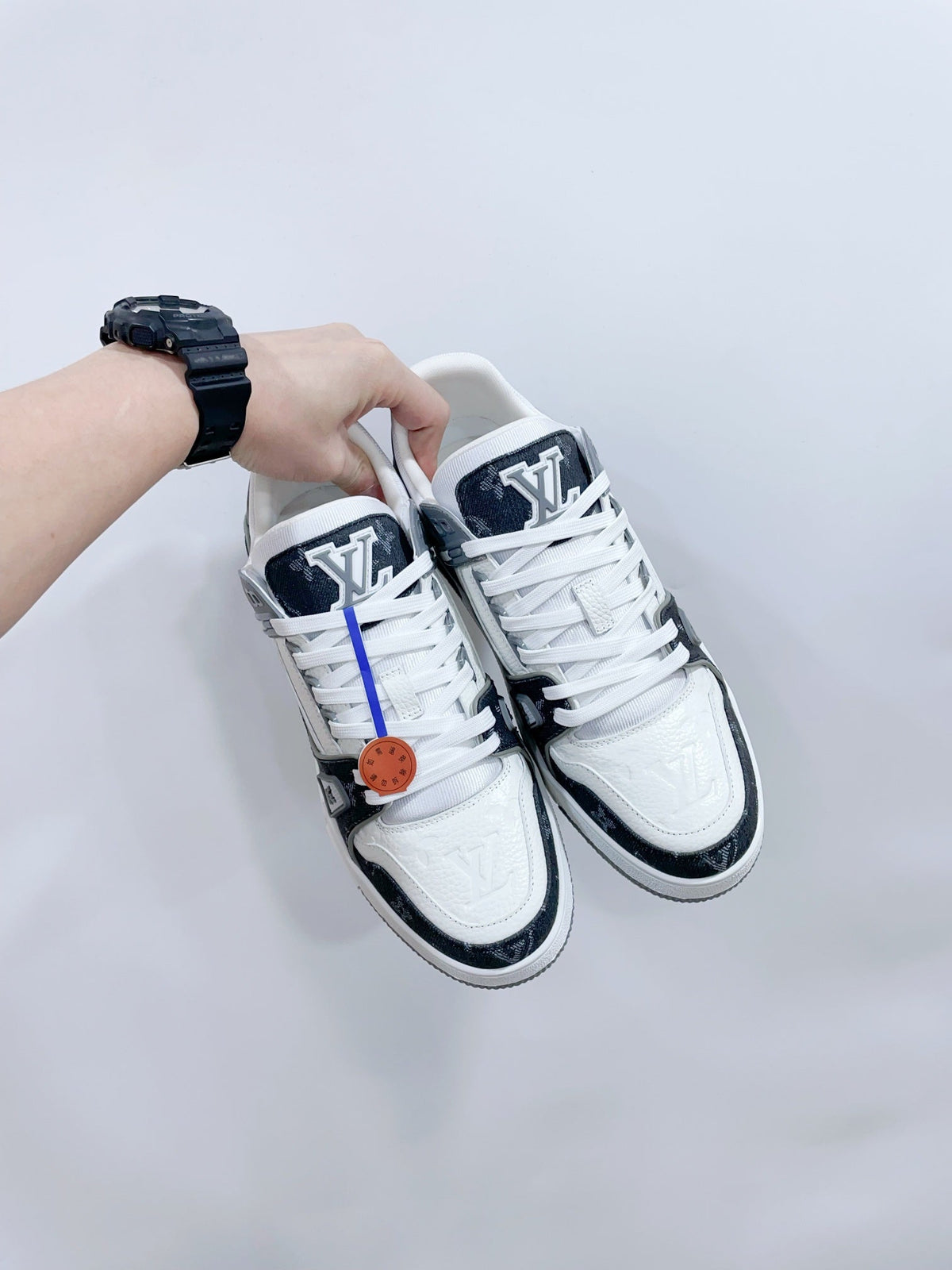 LV TRAINER SNEAKER IN WHITE CALFSKIN AND BLACK MONOGRAM DENIM