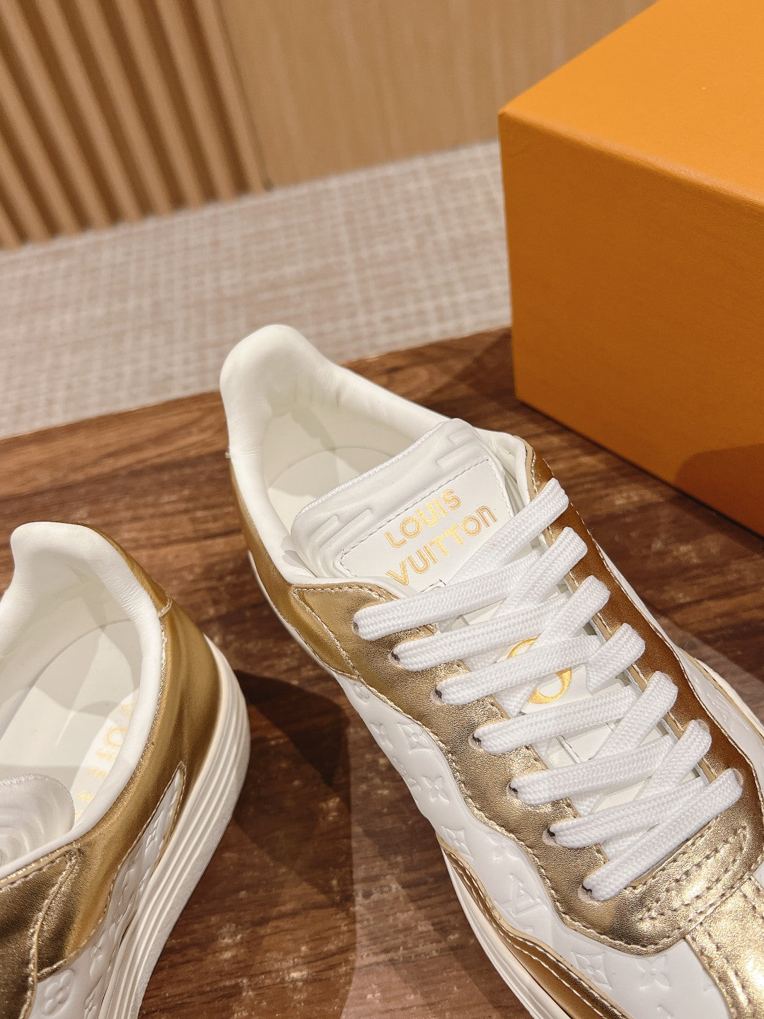 LV TRAINER SNEAKER IN GOLD MIX WHITE EMBOSSED CALFSKIN