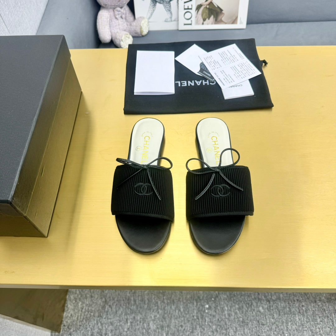BOW SLIPPERS IN BLACK LAMBSKIN