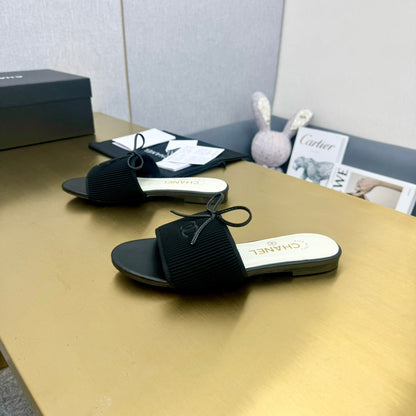 BOW SLIPPERS IN BLACK LAMBSKIN