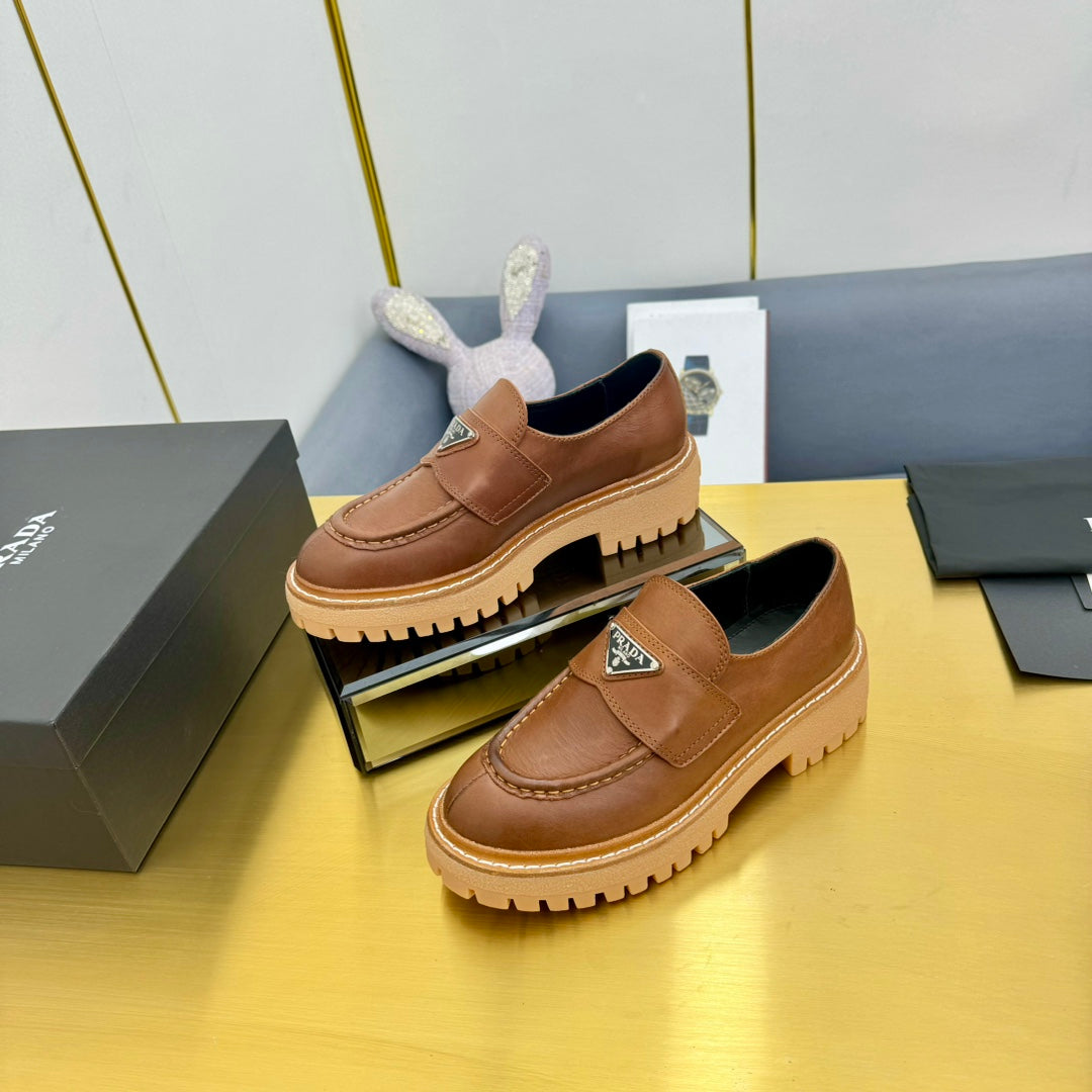 LOAFER WITH TRIANGLE LOGO IN COGNAC CALFSKIN