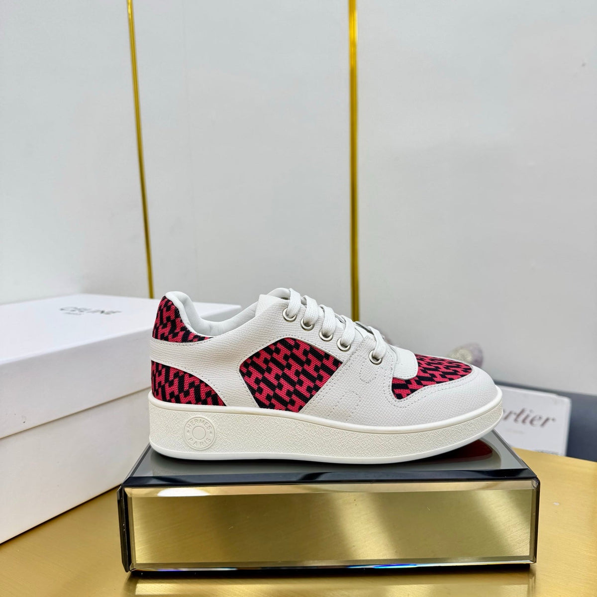FREE SNEAKER IN WHITE CALFSKIN AND "H EN BIAIS" RED CANVAS.