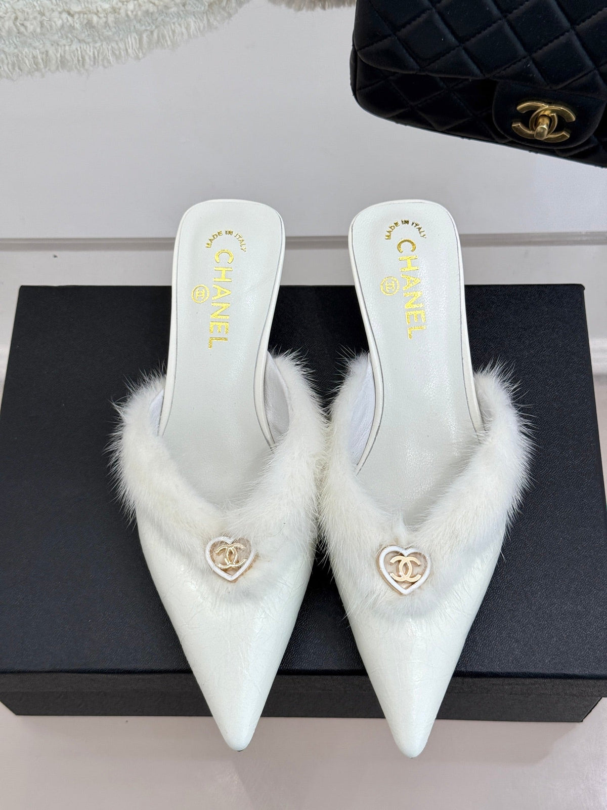 RABBIT FUR POINTED-TOE MULE IN WHITE LAMBSKIN