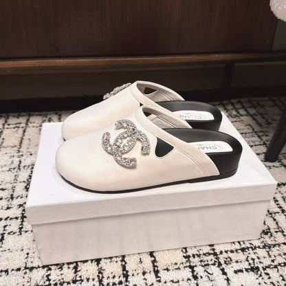 FLAT MULES IN WHITE CALFSKIN