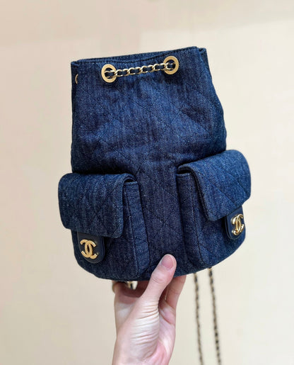 DRAWSTRING BUCKET BACKPACK 24 IN DARK BLUE DENIM GOLD HARDWARE