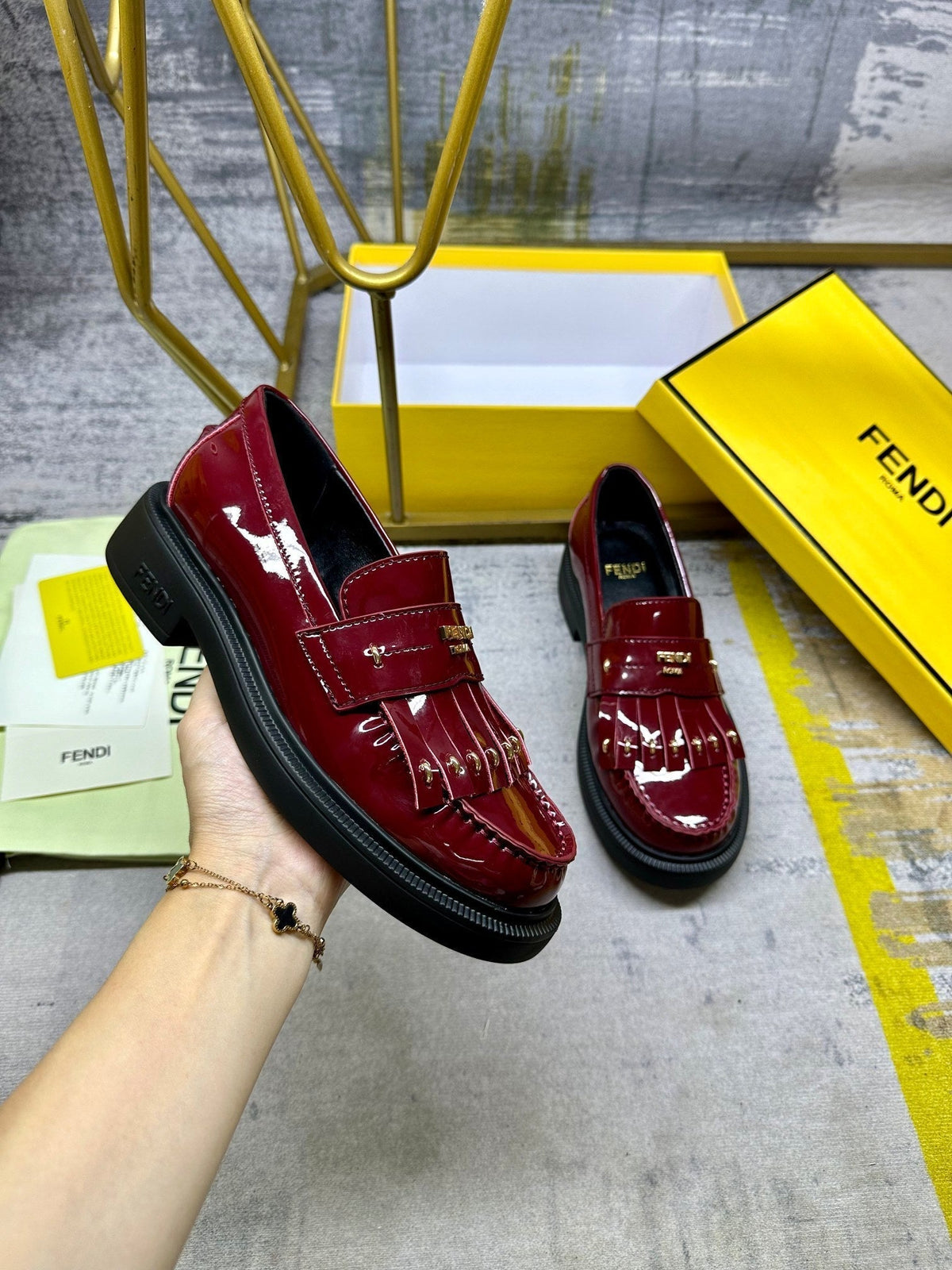 FENDI BAGUETTE LOAFERS IN MAROON RED CALFSKIN WITH GOLD HARDWARE