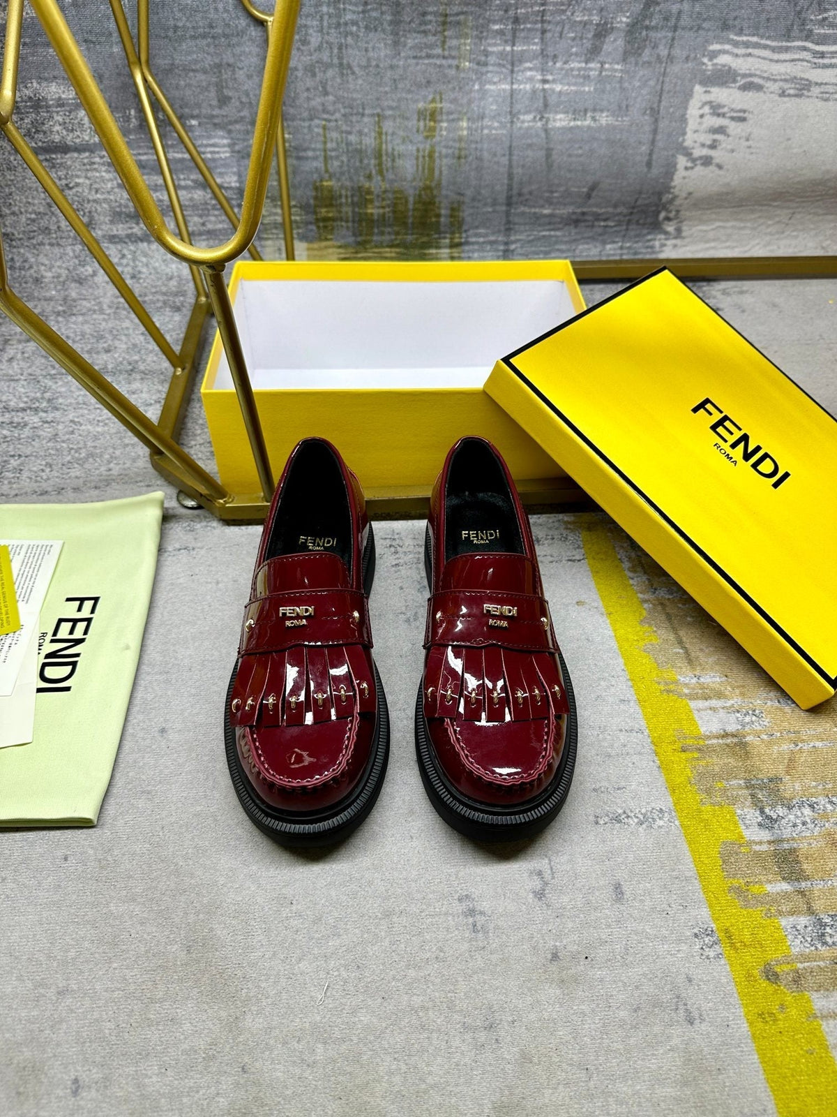 FENDI BAGUETTE LOAFERS IN MAROON RED CALFSKIN WITH GOLD HARDWARE