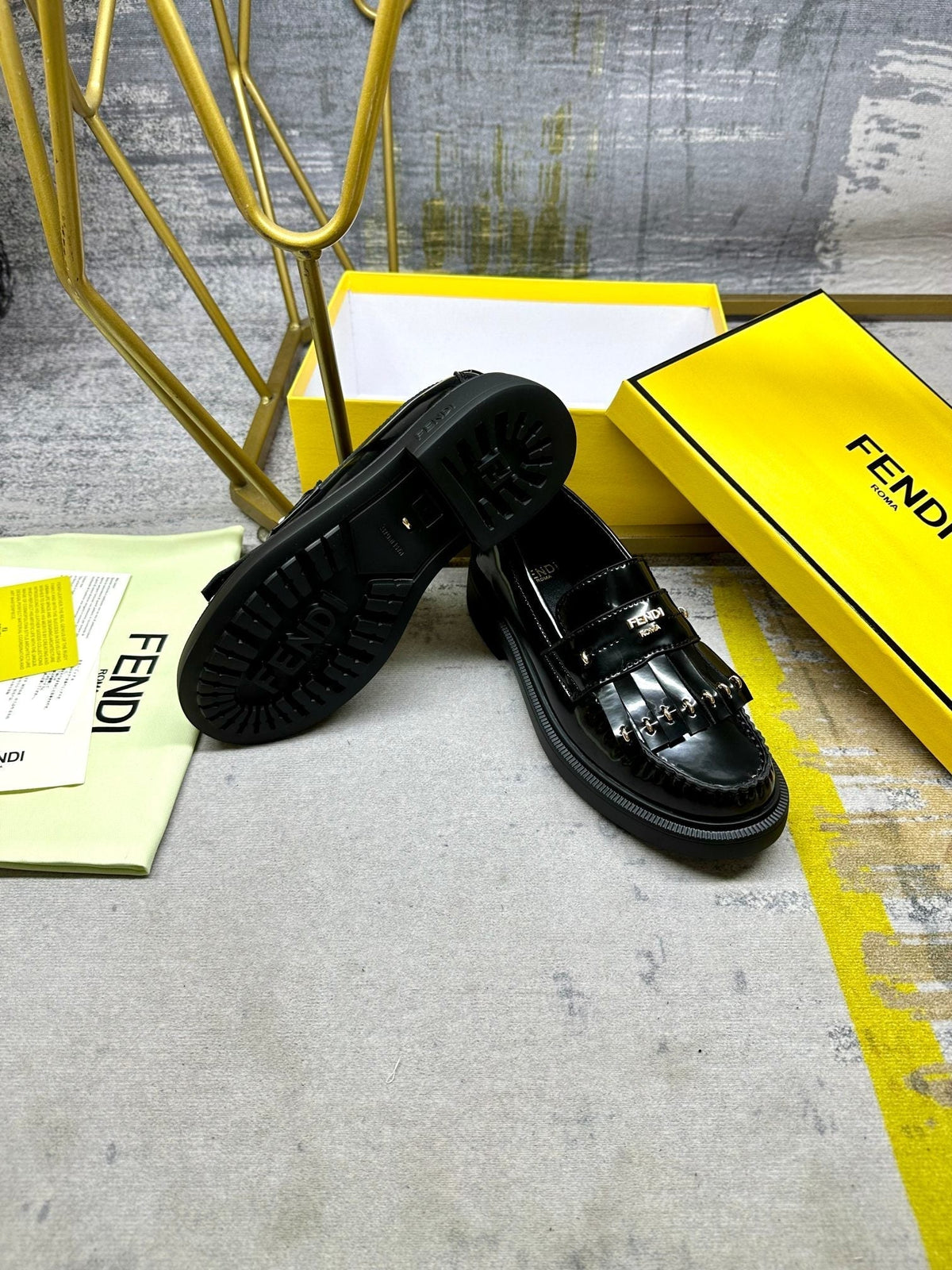 FENDI BAGUETTE LOAFERS IN BLACK CALFSKIN WITH GOLD HARDWARE