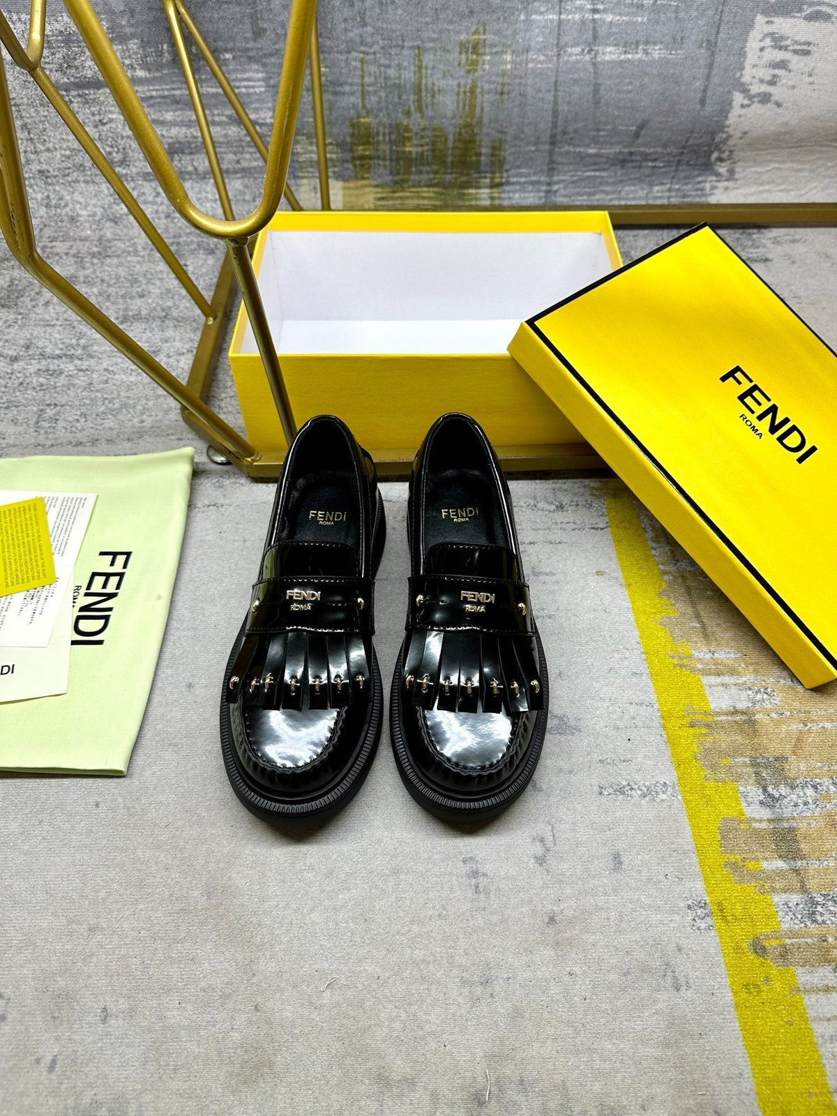 FENDI BAGUETTE LOAFERS IN BLACK CALFSKIN WITH GOLD HARDWARE