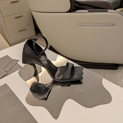 OPEN-TOE CURVED HIGH HEEL SANDALS IN BLACK SMOOTH CALFSKIN