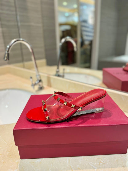 ROCKSTUD MULE SANDALS IN CHERRY RED CALFSKIN AND TRANSPARENT PVC FILM
