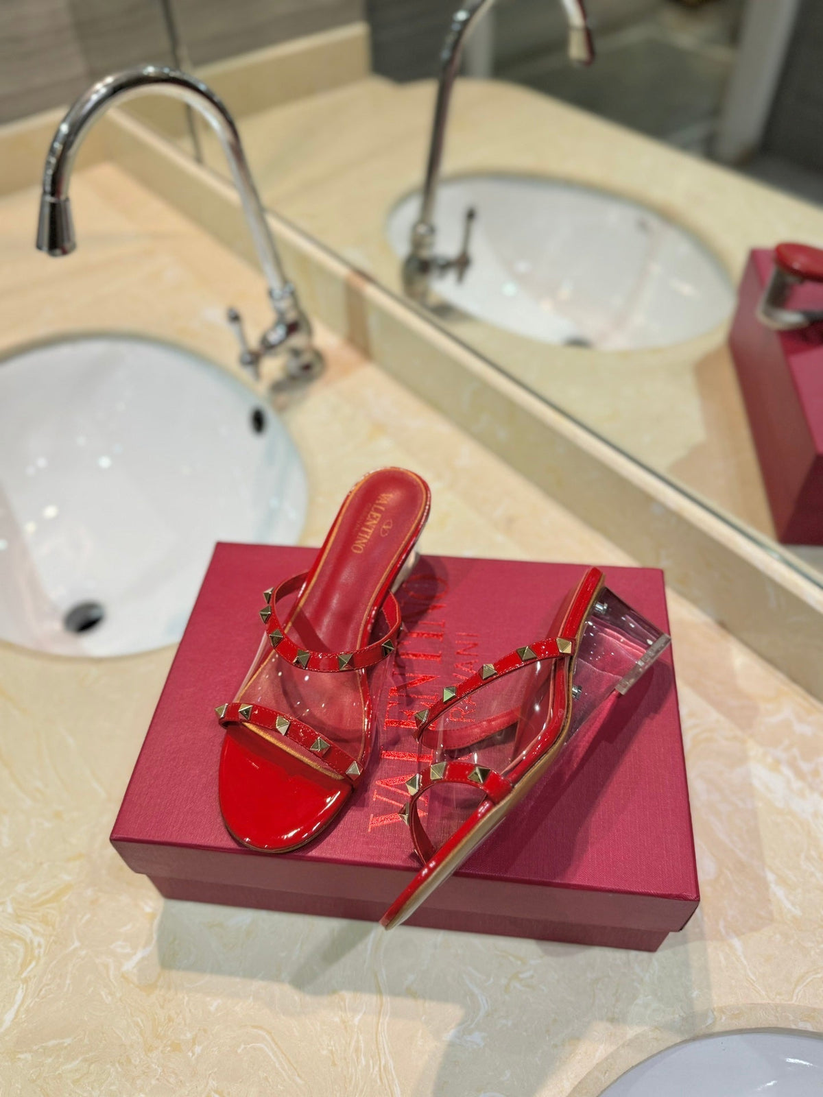 ROCKSTUD MULE SANDALS IN CHERRY RED CALFSKIN AND TRANSPARENT PVC FILM