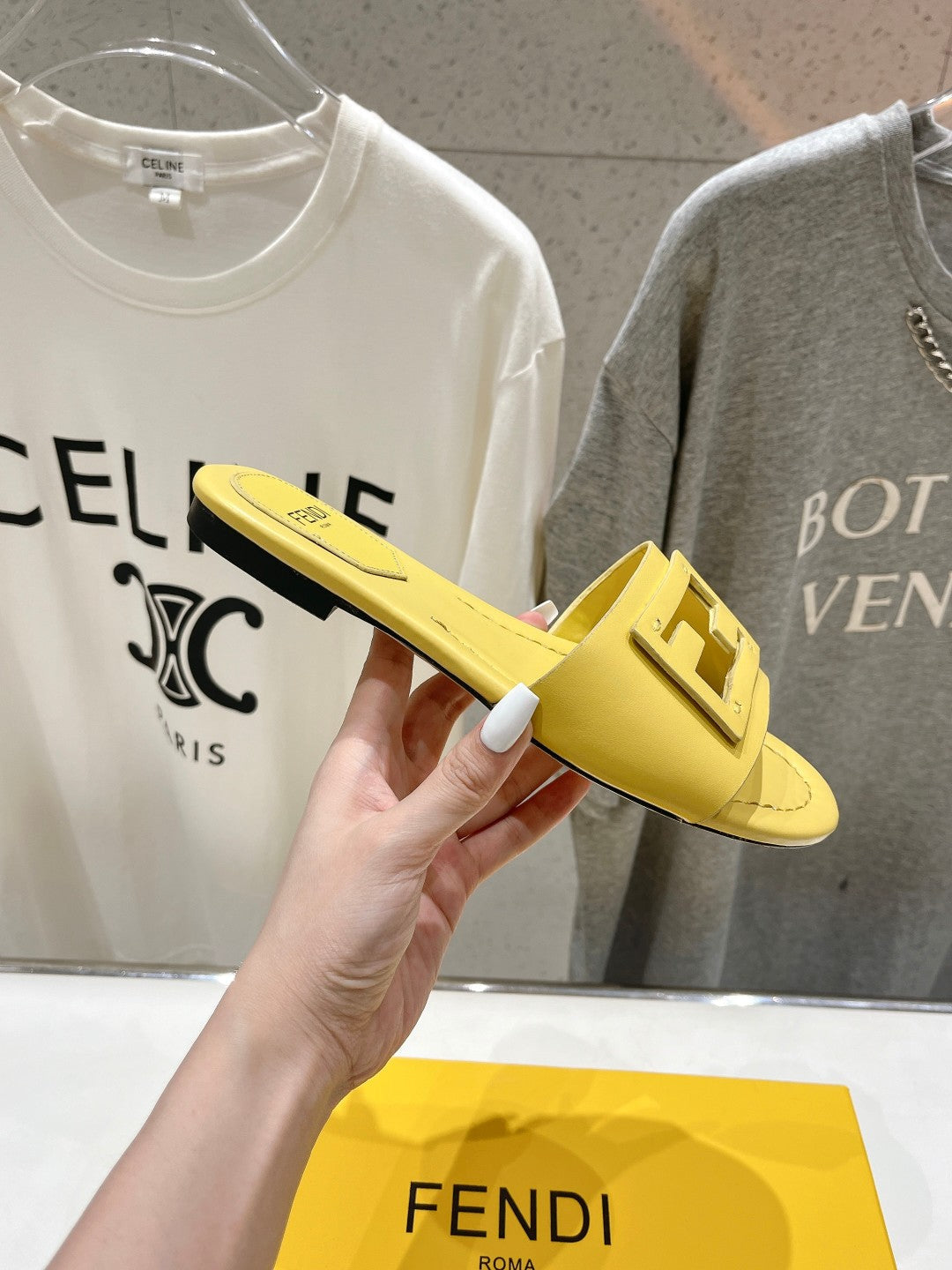 FENDI BAGUETTE SLIDES IN BRIGHT YELLOW LAMBSKIN