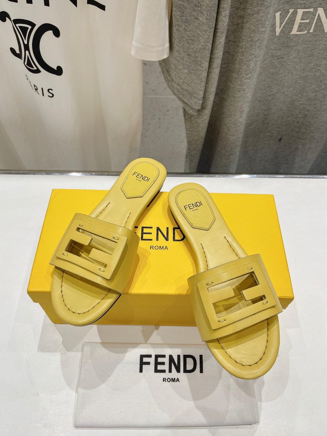 FENDI BAGUETTE SLIDES IN BRIGHT YELLOW LAMBSKIN