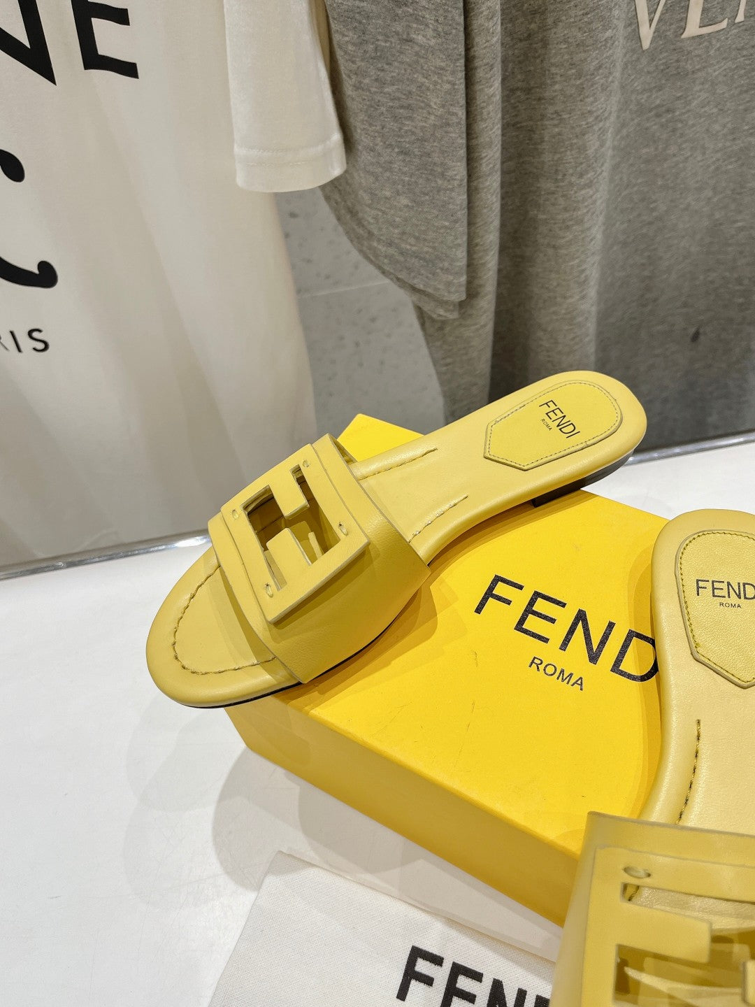 FENDI BAGUETTE SLIDES IN BRIGHT YELLOW LAMBSKIN
