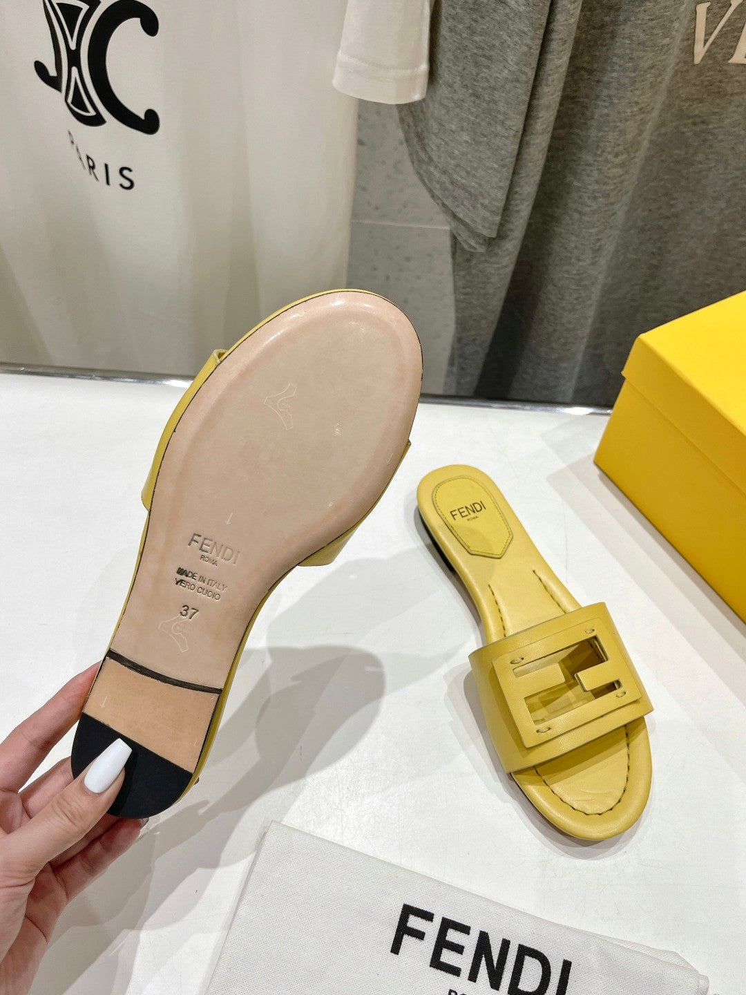 FENDI BAGUETTE SLIDES IN BRIGHT YELLOW LAMBSKIN