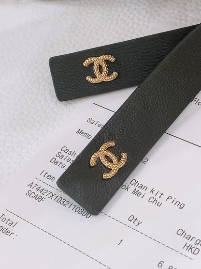 RIBBED BOW WAIST CHAIN IN GOLD TONE BRASS AND BLACK LAMBSKIN